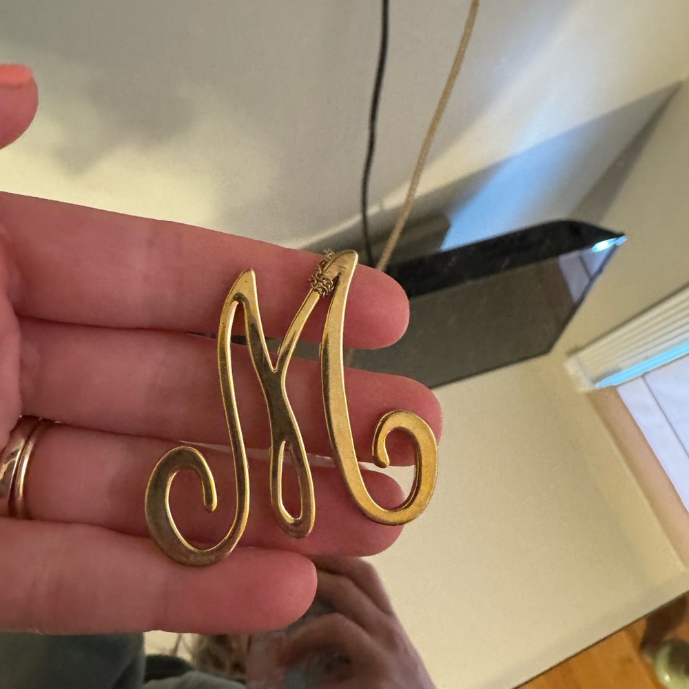 C. Wonder “M” initial long necklace
